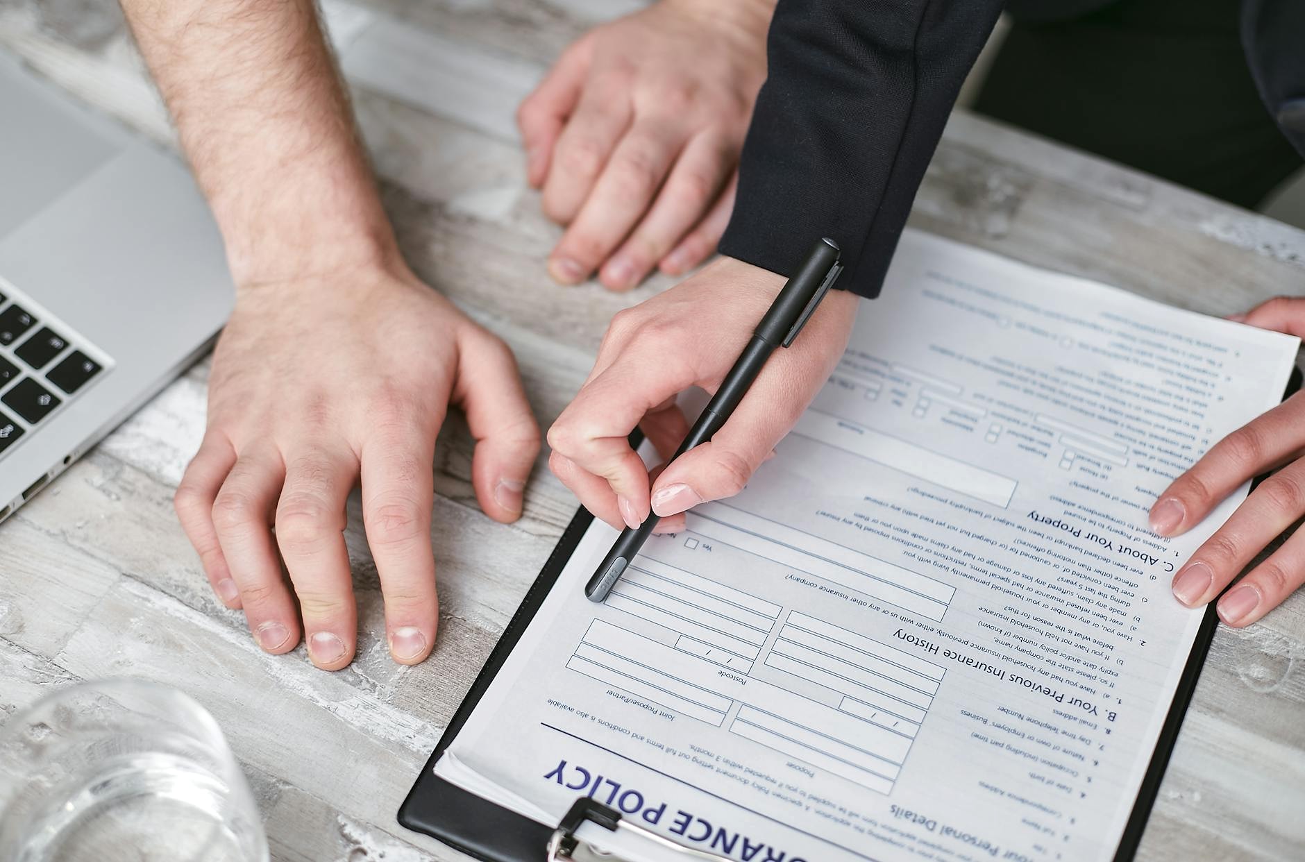 Insurance policy documents on a desk for review
